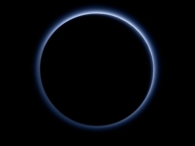 Pluto`s glowing halo shines in new NASA image